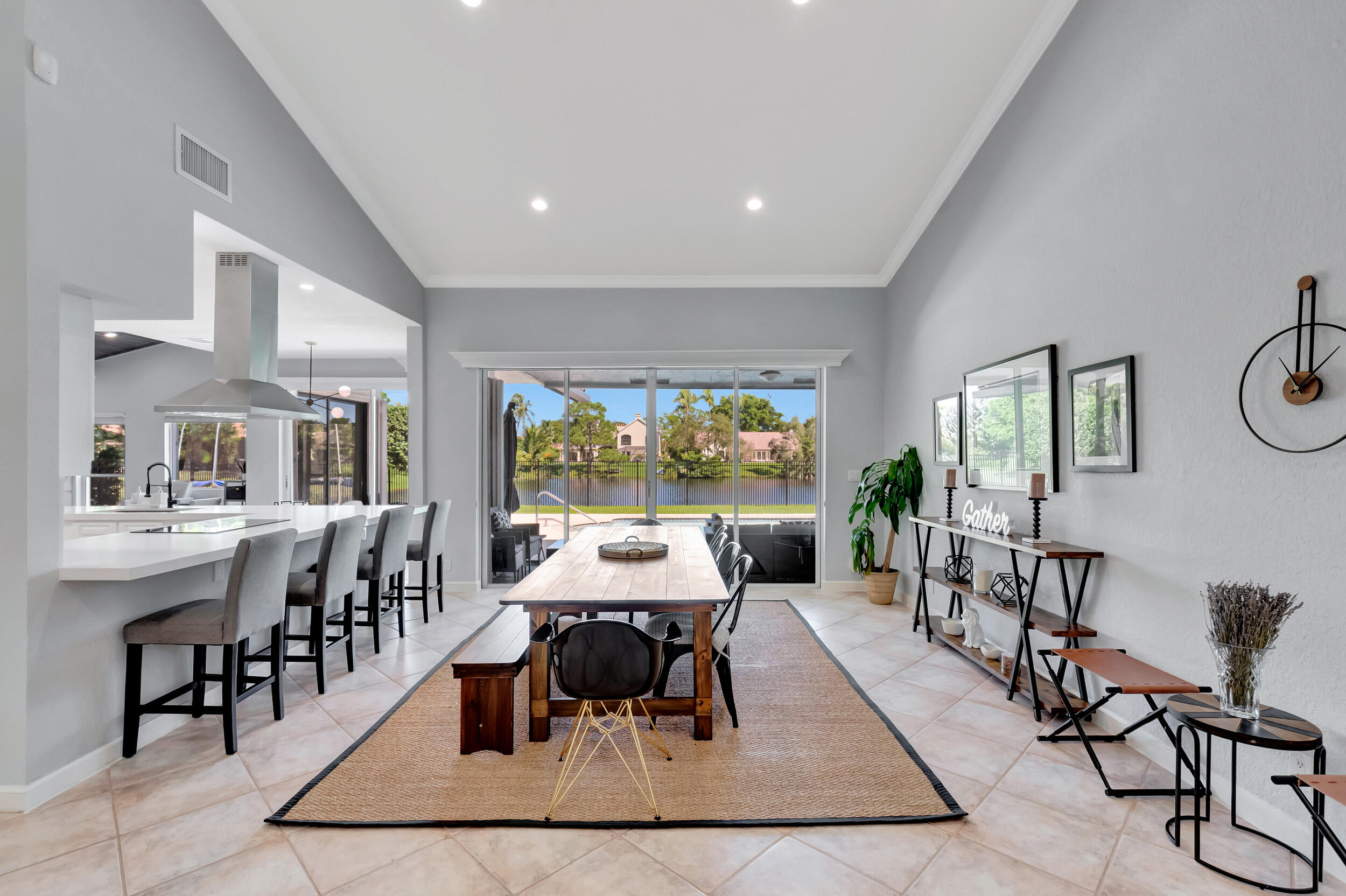 2677 Northwest 46th Street Boca Raton, FL 33434 - Photo 6 of 52 DINING AREA OVERLOOKING POOL/LAKE