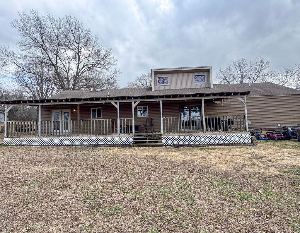127 Walton Loop Covington, TN 38019 - Photo 37 of 40 a front view of a house with a garden