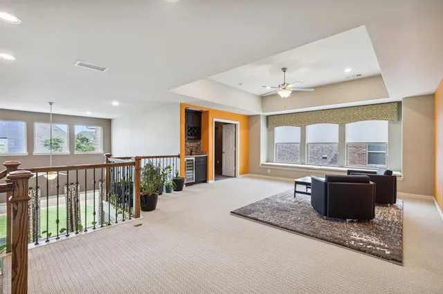 a spacious bedroom with a large bed and large window