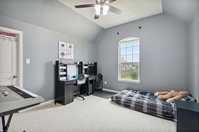 a bedroom with bed and window