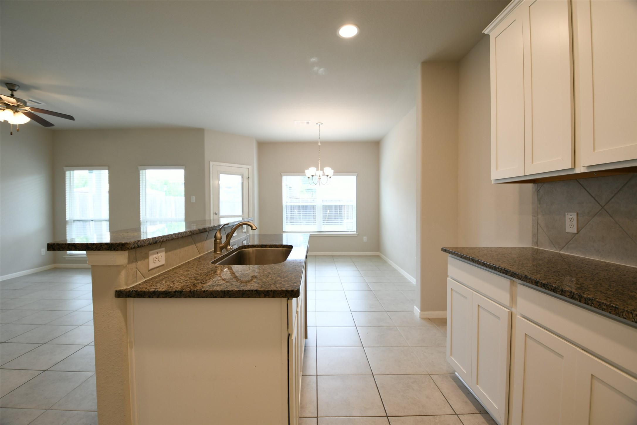 104 Camelot Pl Court Conroe, TX 77304 - Photo 12 of 34 a bathroom with a granite countertop sink a toilet and mirror