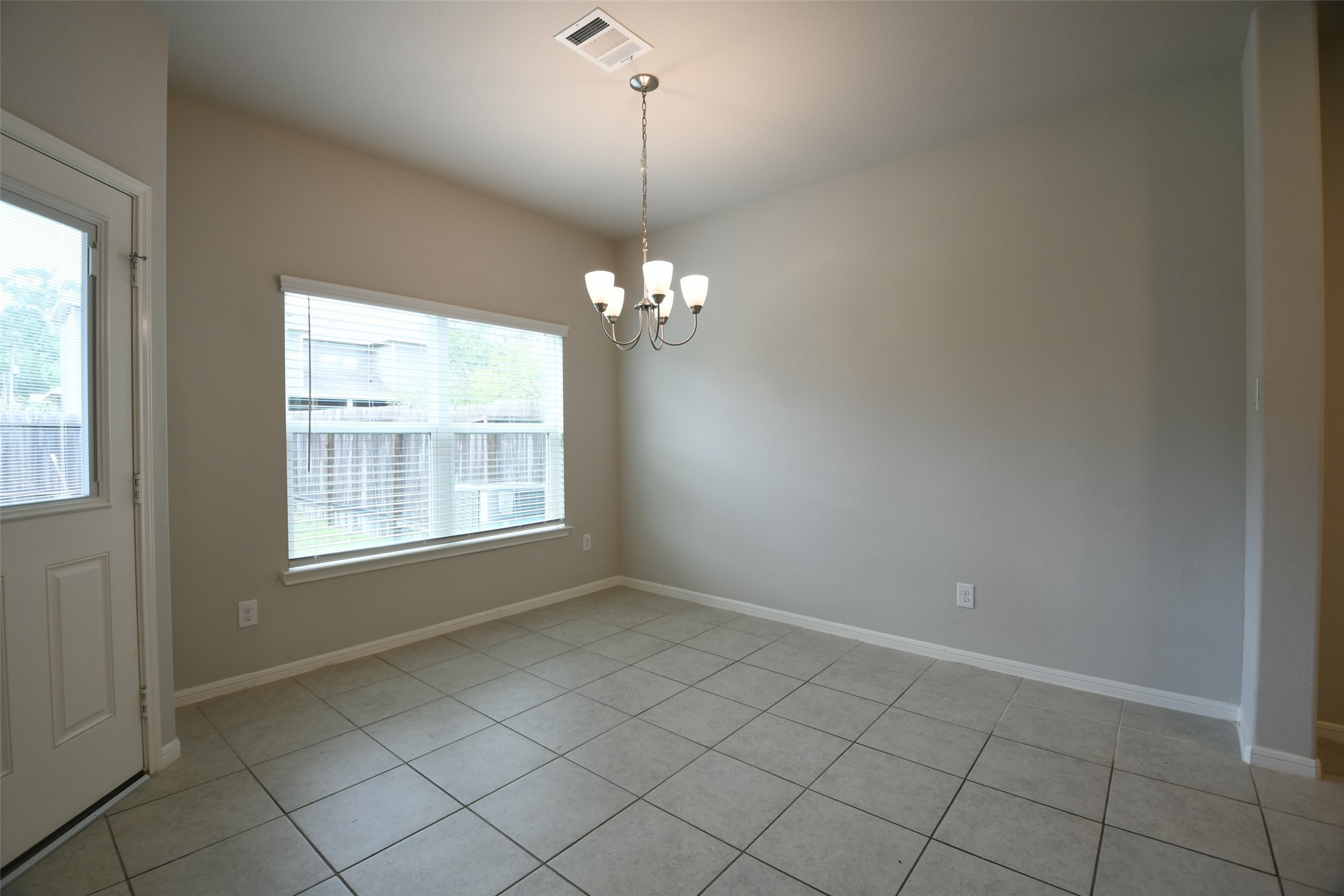 104 Camelot Pl Court Conroe, TX 77304 - Photo 14 of 34 a view of an empty room with windows