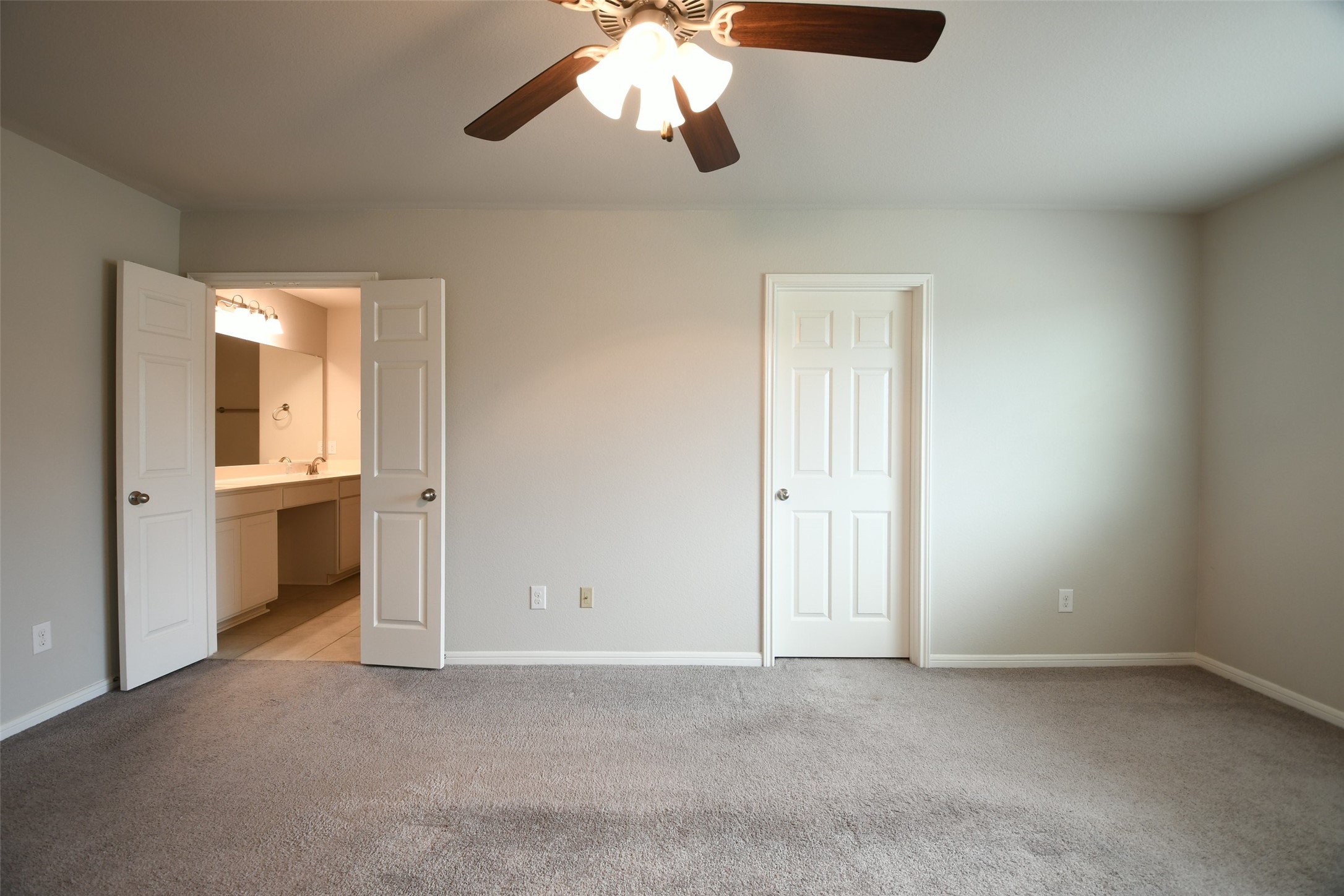 104 Camelot Pl Court Conroe, TX 77304 - Photo 18 of 34 a view of a room with a ceiling fan and a window