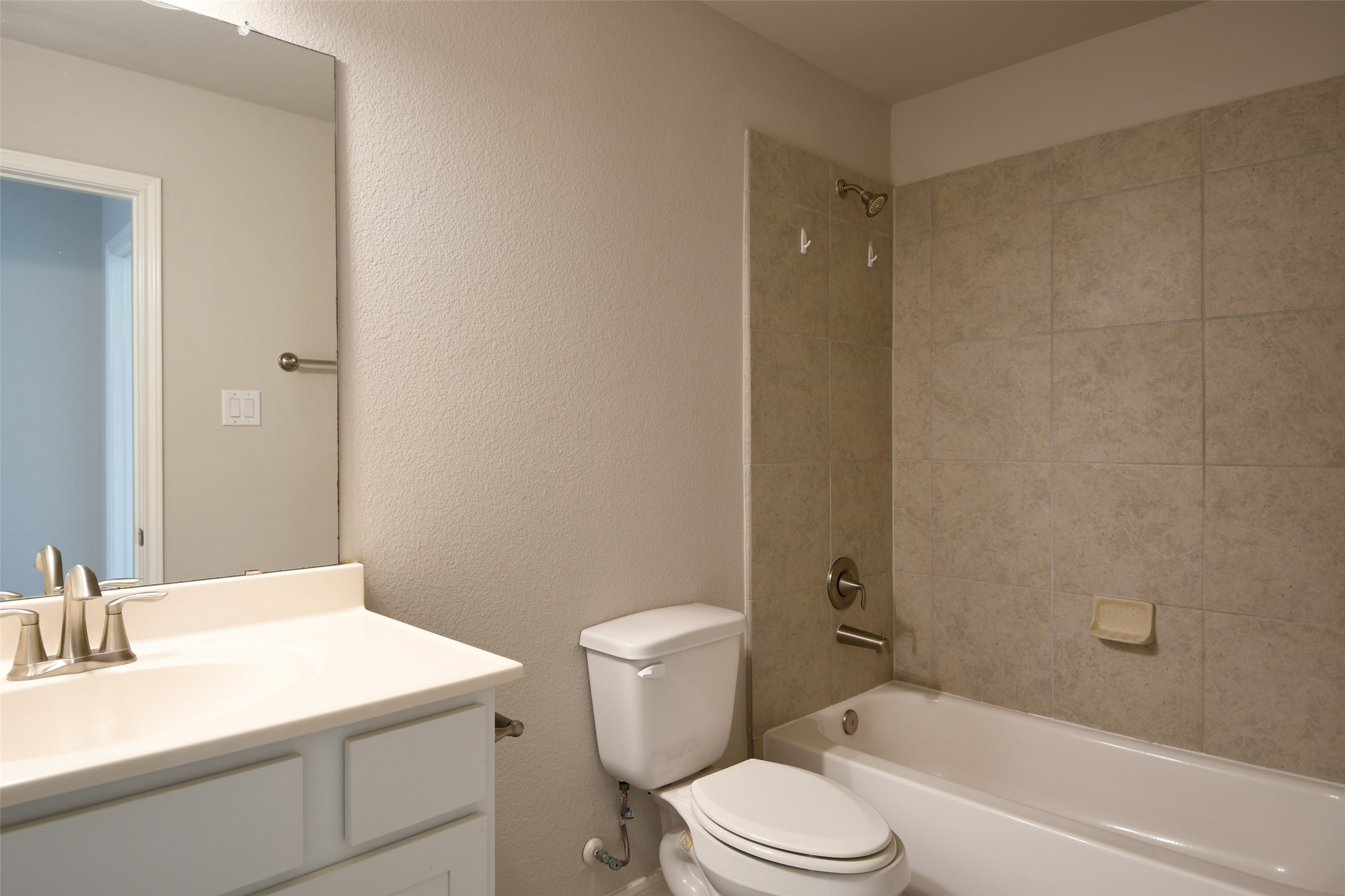 104 Camelot Pl Court Conroe, TX 77304 - Photo 26 of 34 a bathroom with a sink a toilet and shower