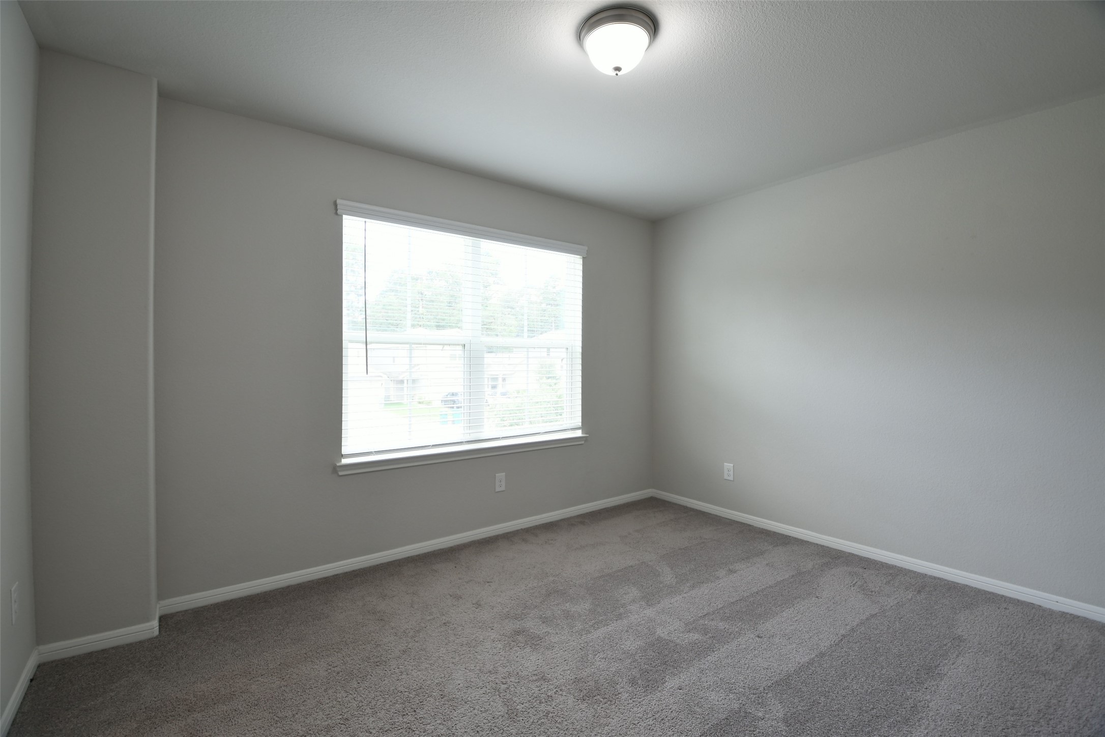 104 Camelot Pl Court Conroe, TX 77304 - Photo 28 of 34 an empty room with a window