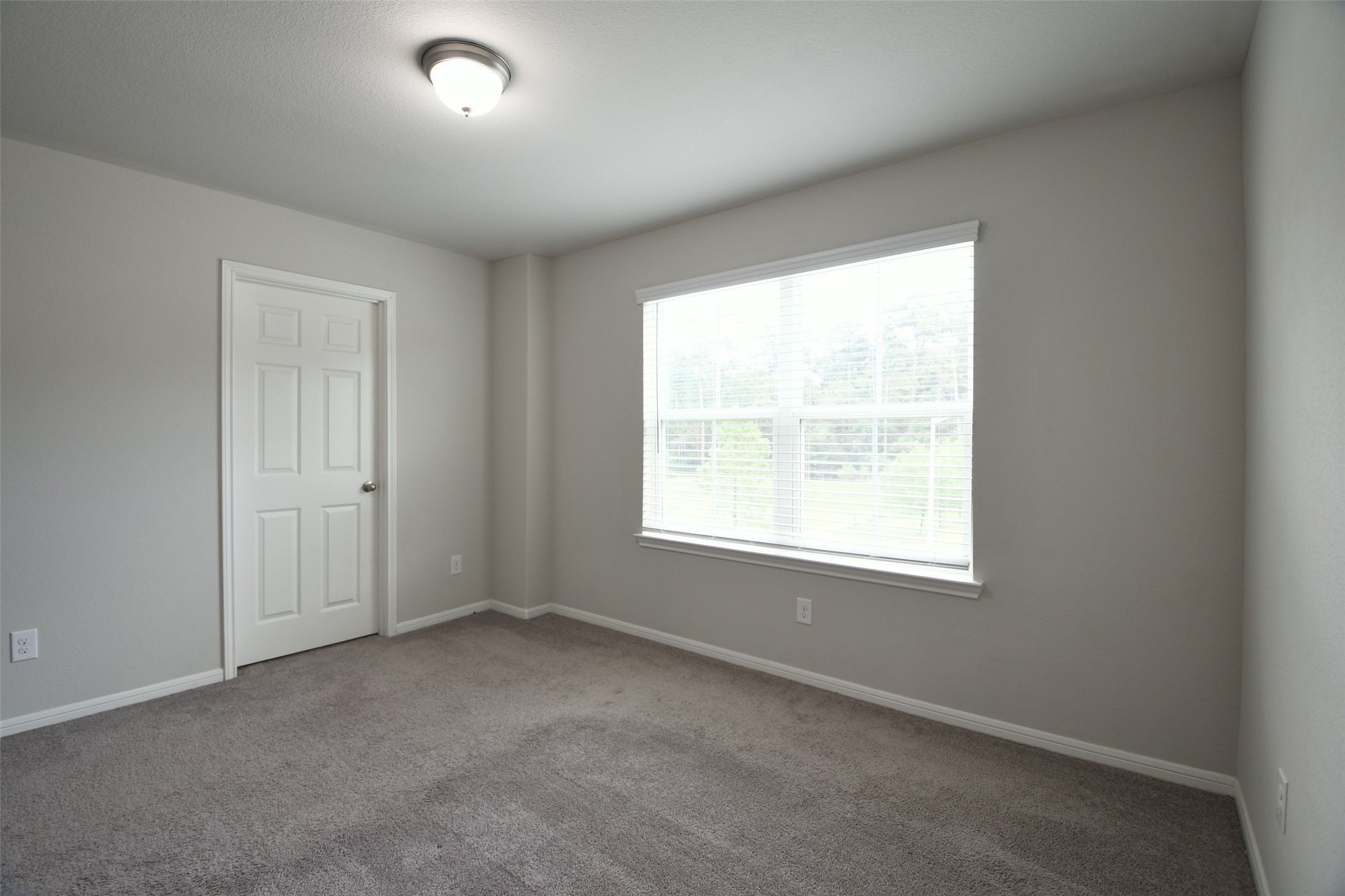 104 Camelot Pl Court Conroe, TX 77304 - Photo 29 of 34 an empty room with a window