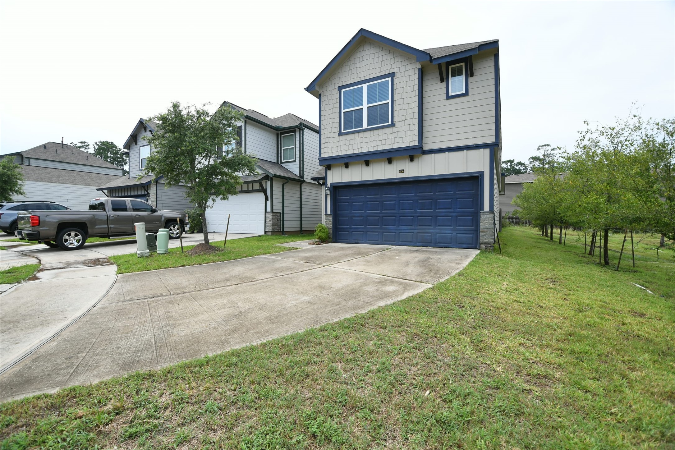 104 Camelot Pl Court Conroe, TX 77304 - Photo 3 of 34 a house view with a garden space