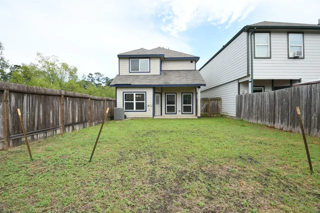a backyard of a house with a garden