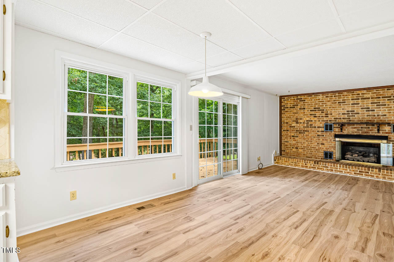 2330 Thunder Road Durham, NC 27712 - Photo 15 of 44 a view of an empty room with wooden floor and a window