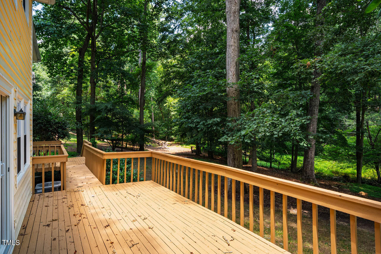 2330 Thunder Road Durham, NC 27712 - Photo 35 of 44 a view of balcony with deck and trees