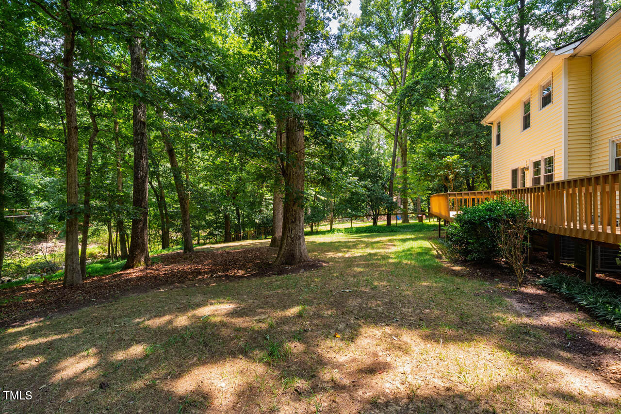 2330 Thunder Road Durham, NC 27712 - Photo 40 of 44 a view of a yard with large trees