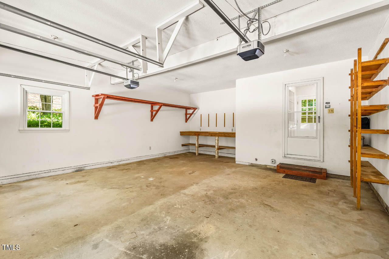 2330 Thunder Road Durham, NC 27712 - Photo 43 of 44 a view of a room with wooden floor and windows