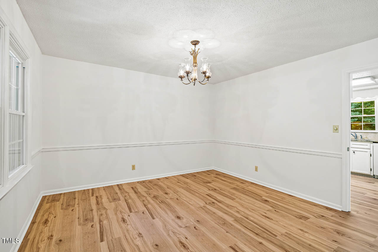 2330 Thunder Road Durham, NC 27712 - Photo 8 of 44 a view of a room with wooden floor