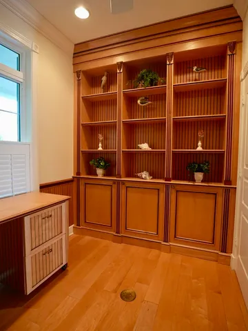 a view of a room with shelves on the wall