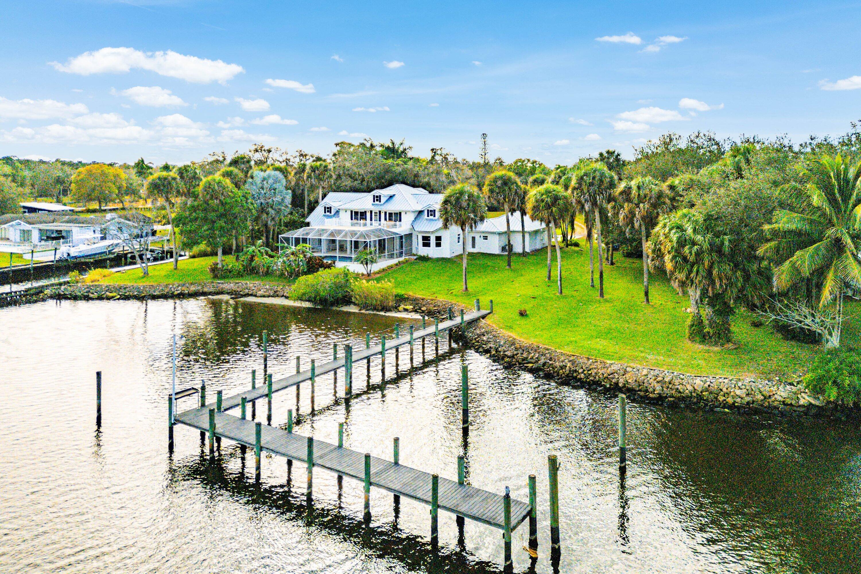 5855 Southwest Mapp Road Palm City, FL 34990 - Photo 48 of 60 48Day-HouseWaterAriel3