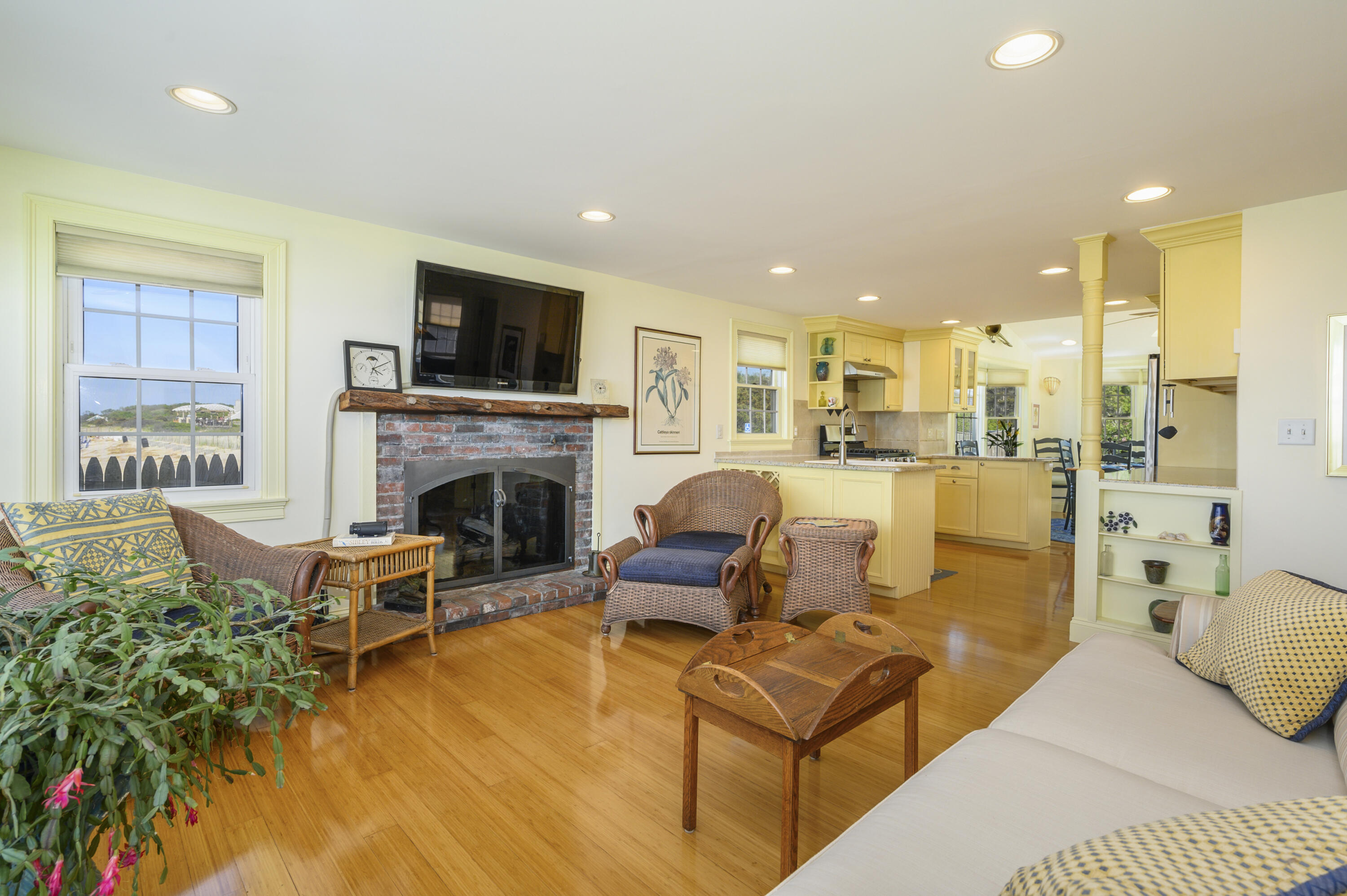 51 Captain Dunbar Road Brewster, MA 02631 - Photo 11 of 36 a living room with furniture or flat screen tv and a fireplace