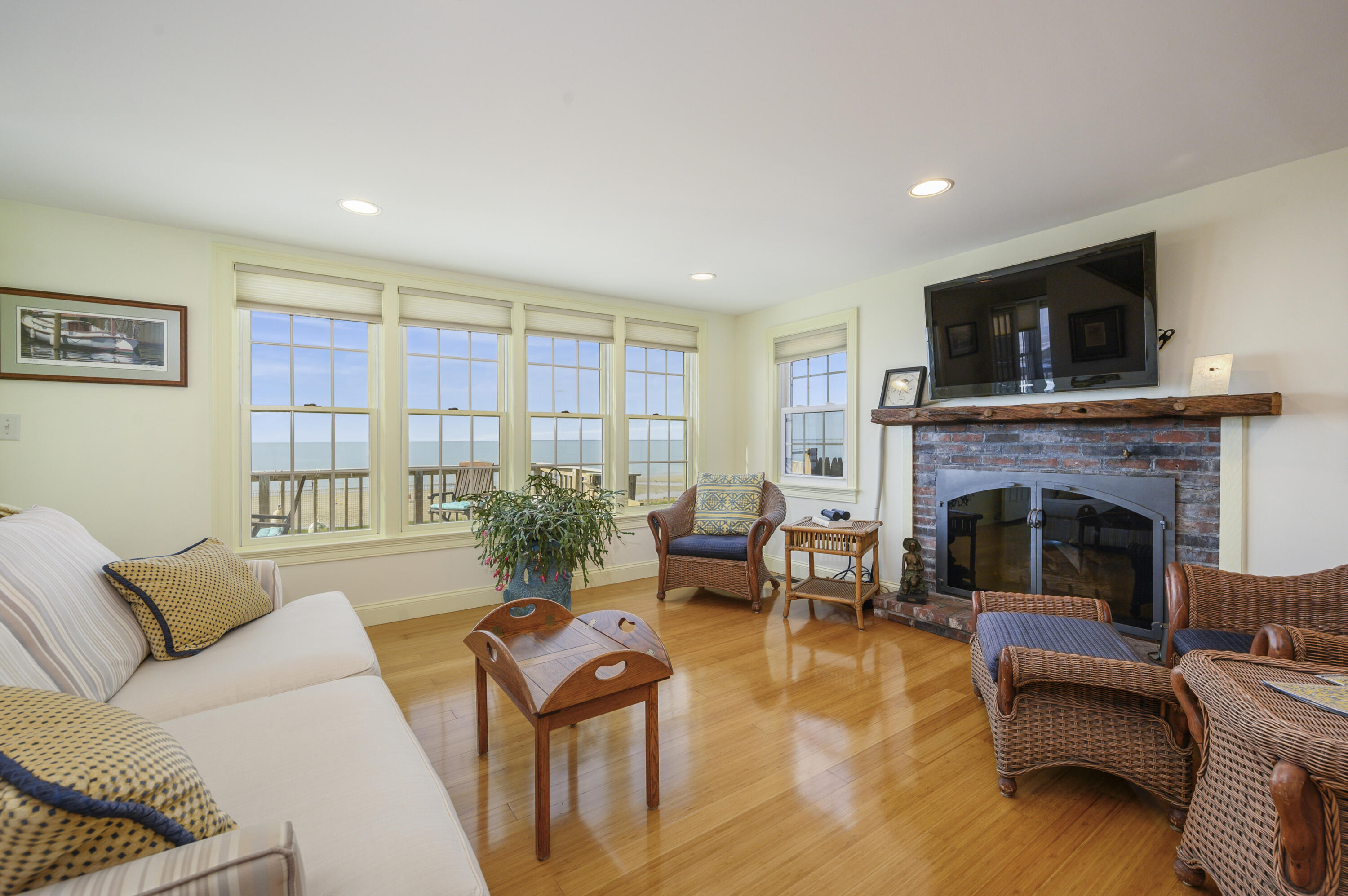 51 Captain Dunbar Road Brewster, MA 02631 - Photo 12 of 36 a living room with furniture and a fireplace