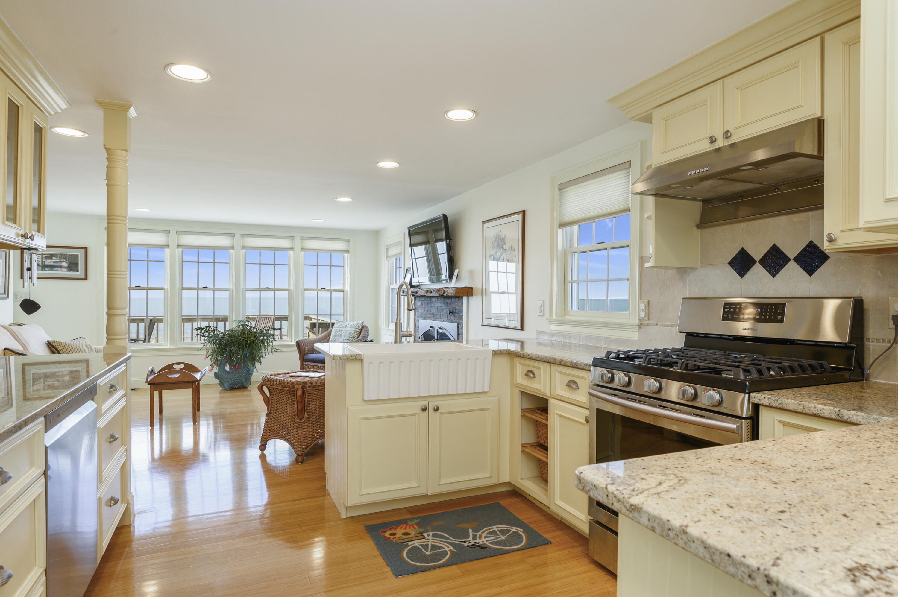 51 Captain Dunbar Road Brewster, MA 02631 - Photo 14 of 36 a kitchen with granite countertop a stove a sink and a refrigerator