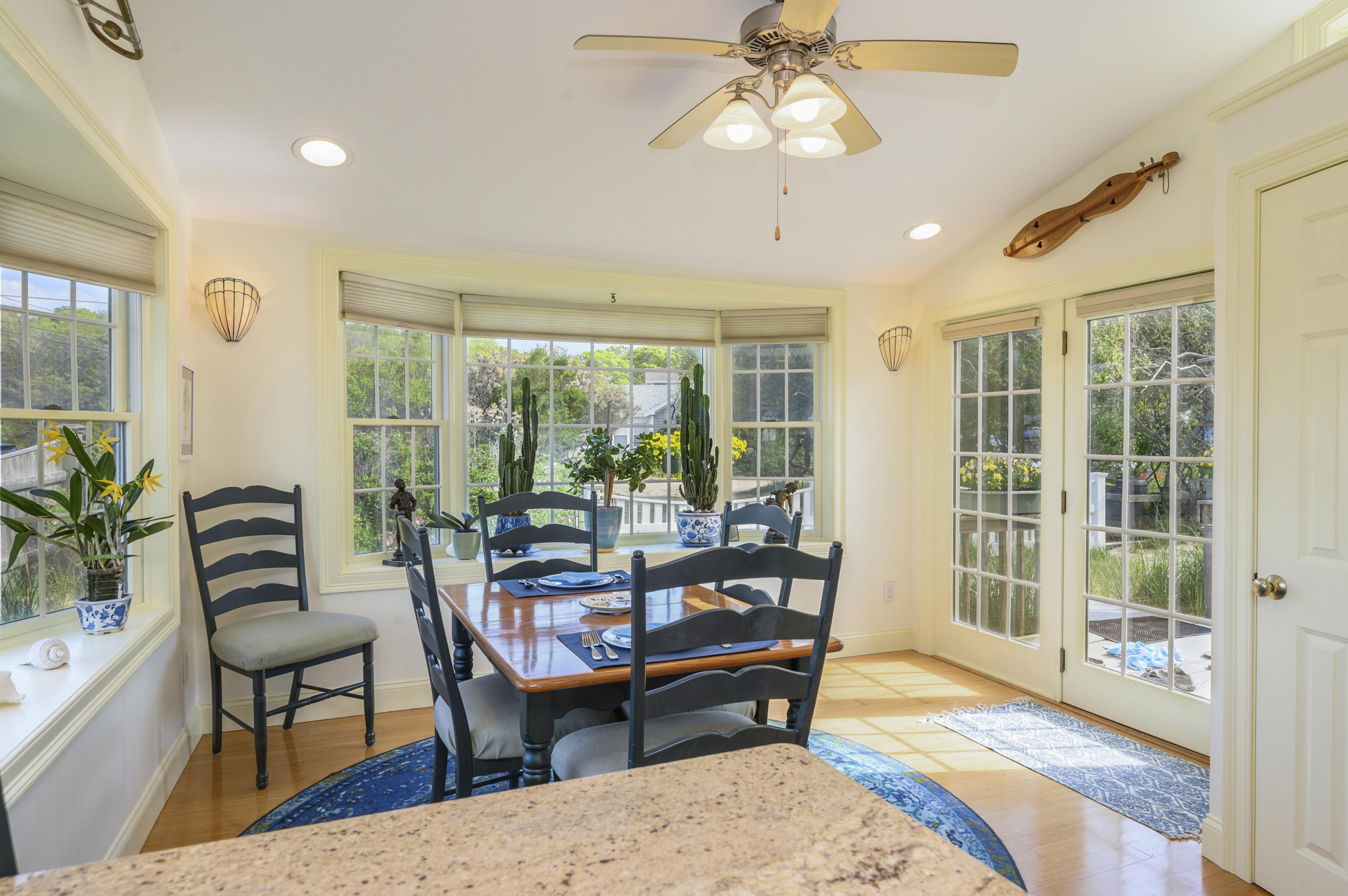 51 Captain Dunbar Road Brewster, MA 02631 - Photo 16 of 36 a living room with furniture and a floor to ceiling window