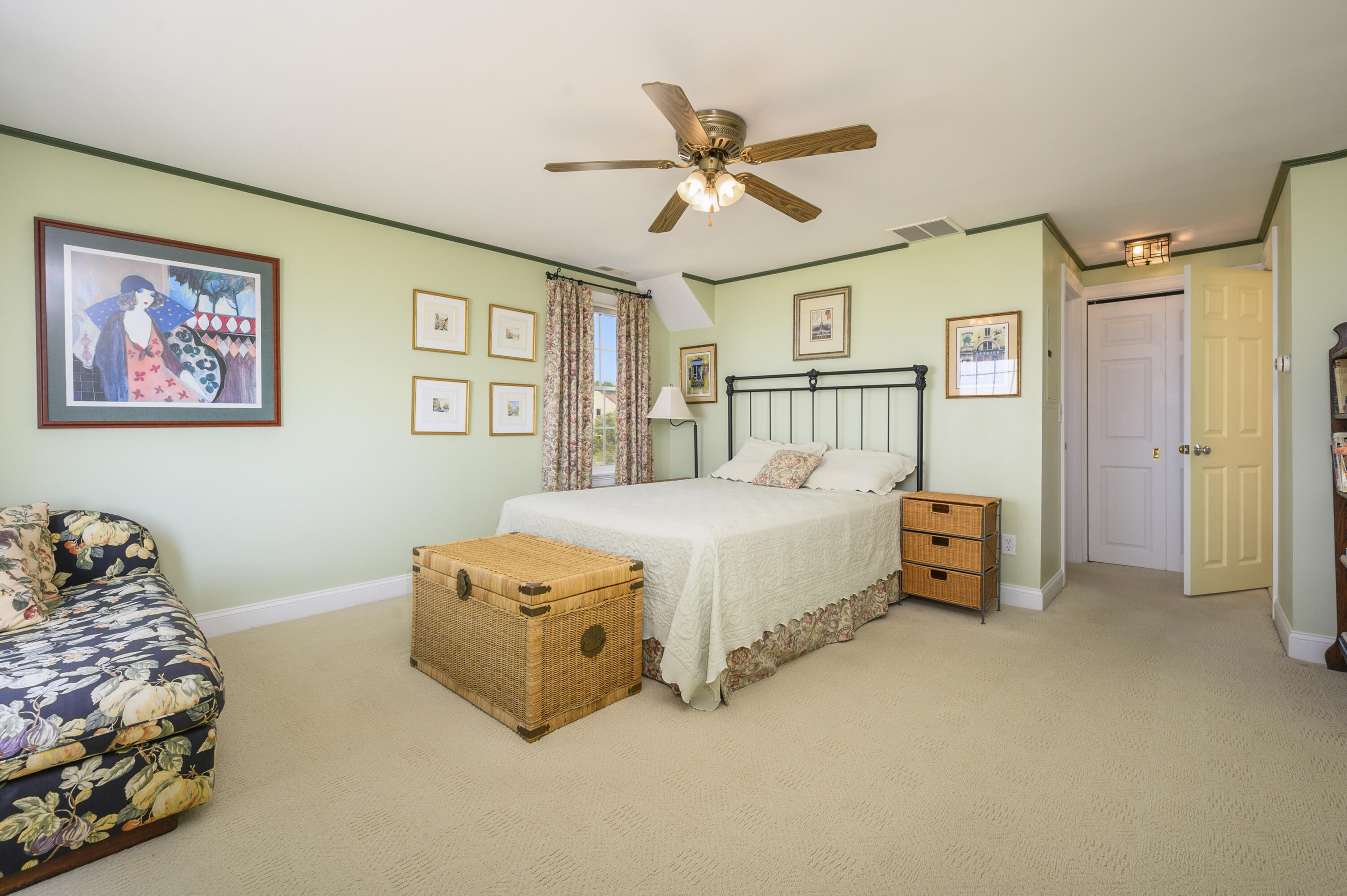 51 Captain Dunbar Road Brewster, MA 02631 - Photo 21 of 36 a spacious bedroom with a bed and a chandelier