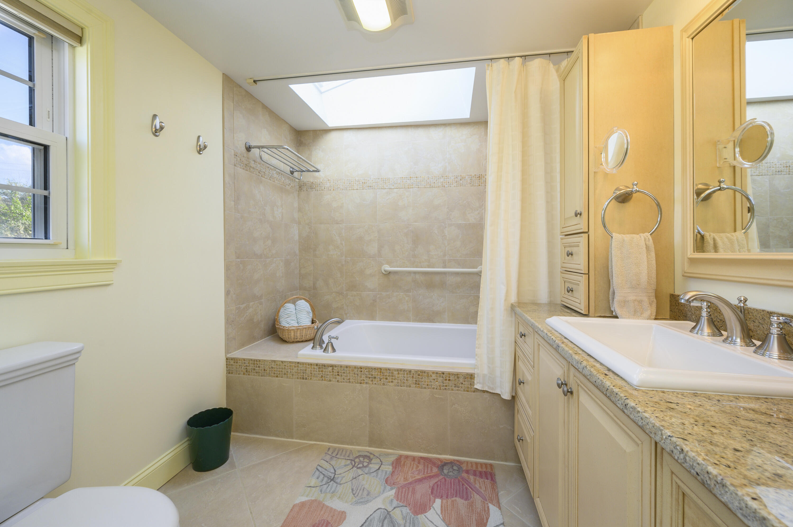 51 Captain Dunbar Road Brewster, MA 02631 - Photo 22 of 36 a bathroom with a granite countertop sink a toilet and shower