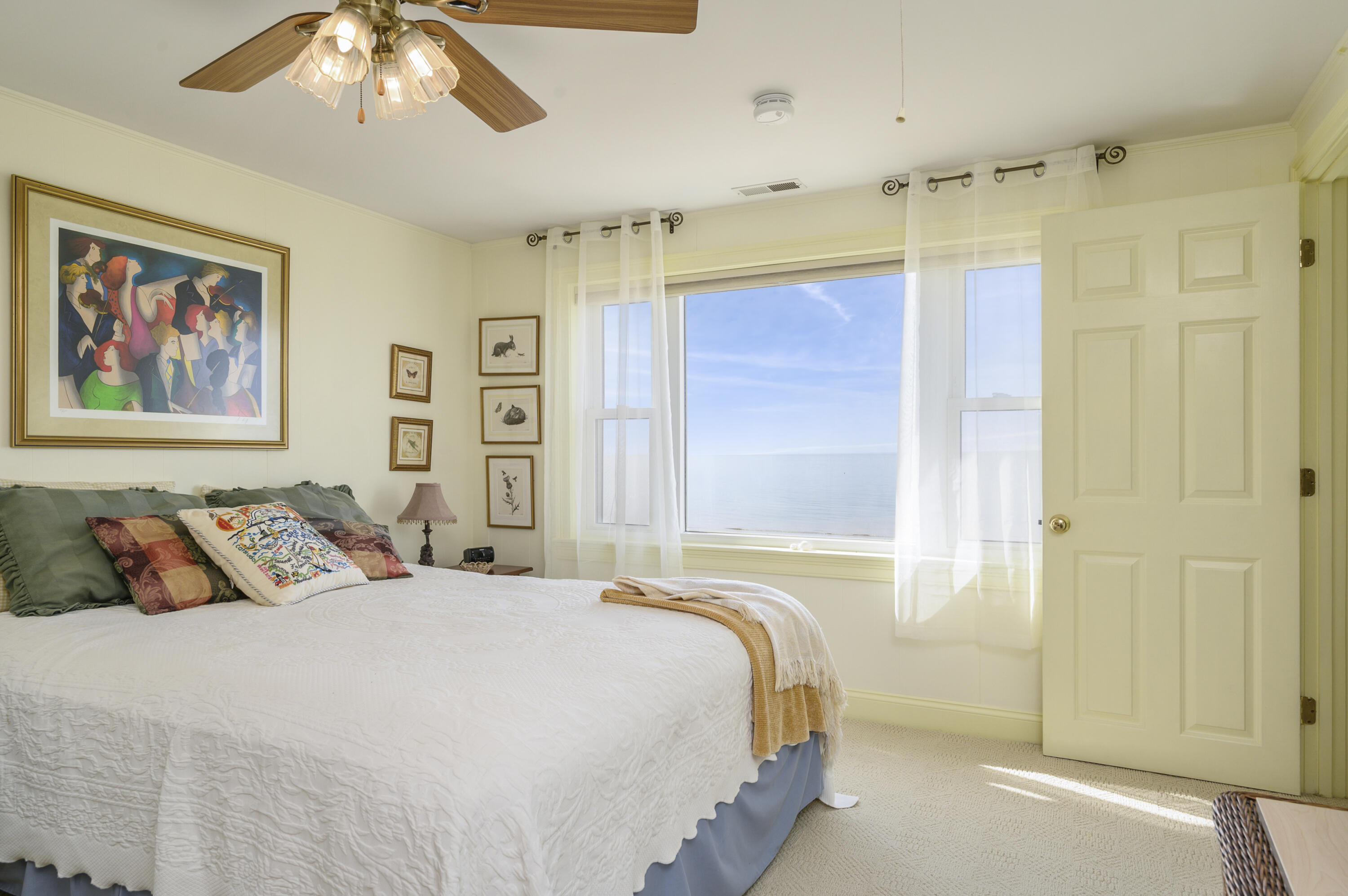 51 Captain Dunbar Road Brewster, MA 02631 - Photo 24 of 36 a bedroom with a bed and a painting on the wall