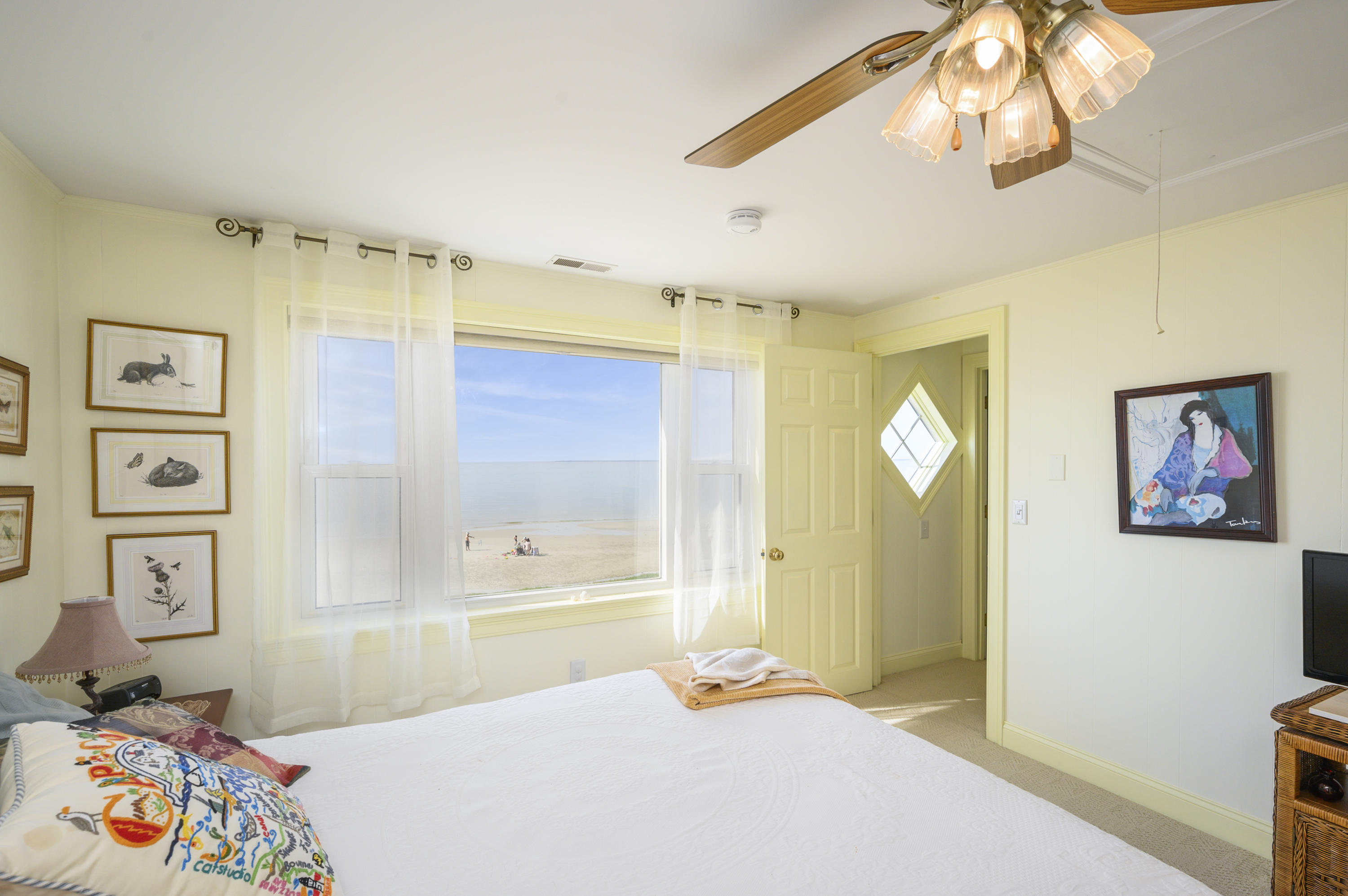 51 Captain Dunbar Road Brewster, MA 02631 - Photo 27 of 36 a bedroom with a bed and a painting on the wall