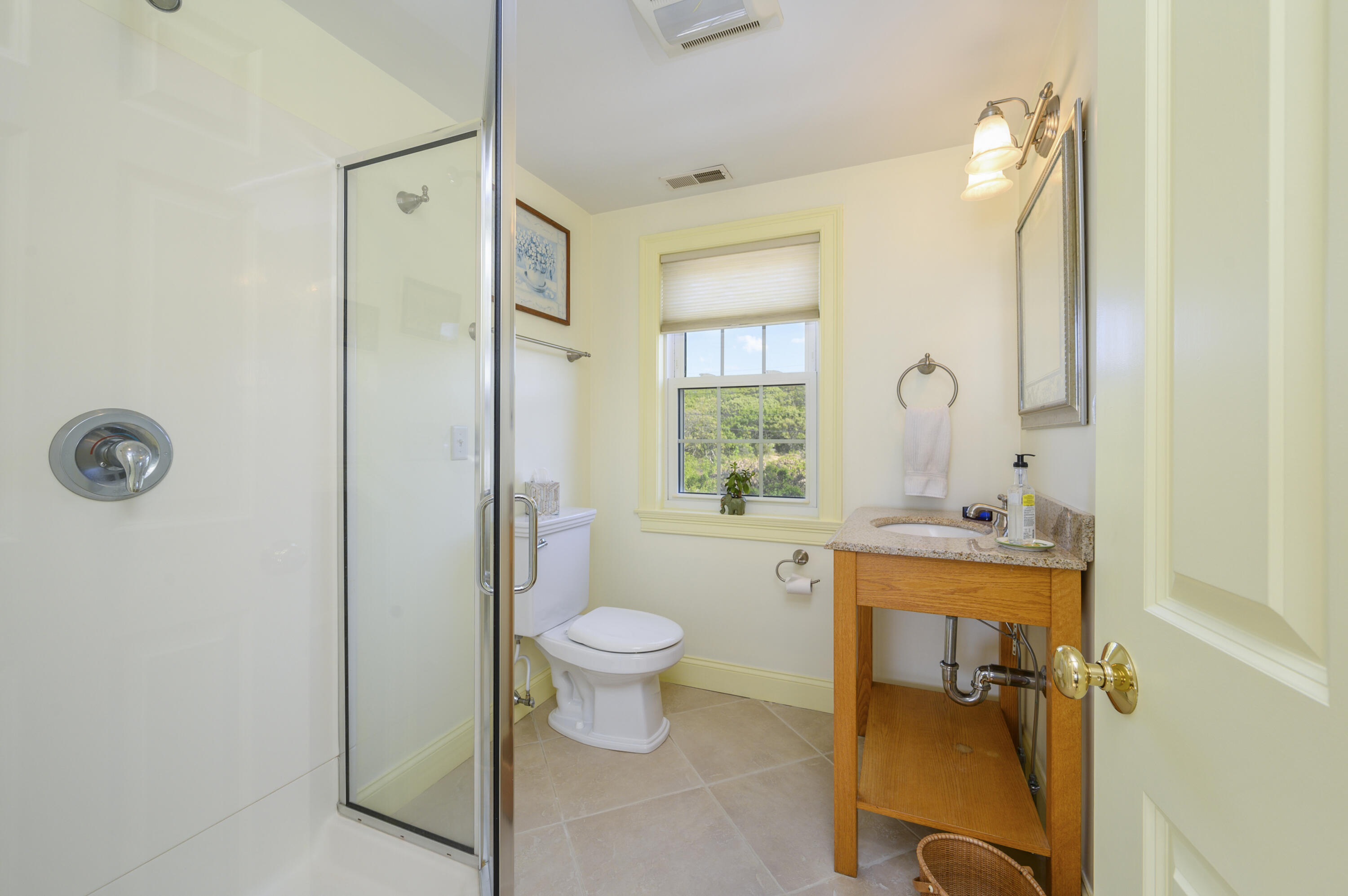 51 Captain Dunbar Road Brewster, MA 02631 - Photo 28 of 36 a bathroom with a toilet sink and mirror