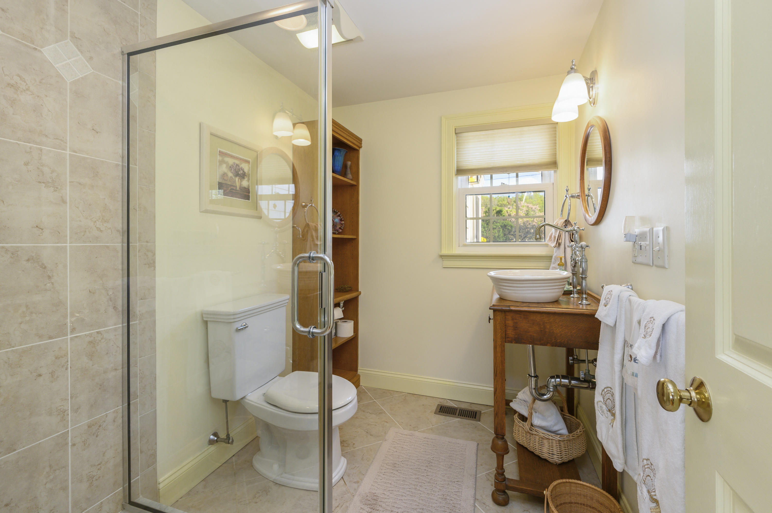51 Captain Dunbar Road Brewster, MA 02631 - Photo 29 of 36 a bathroom with a toilet a sink and a mirror