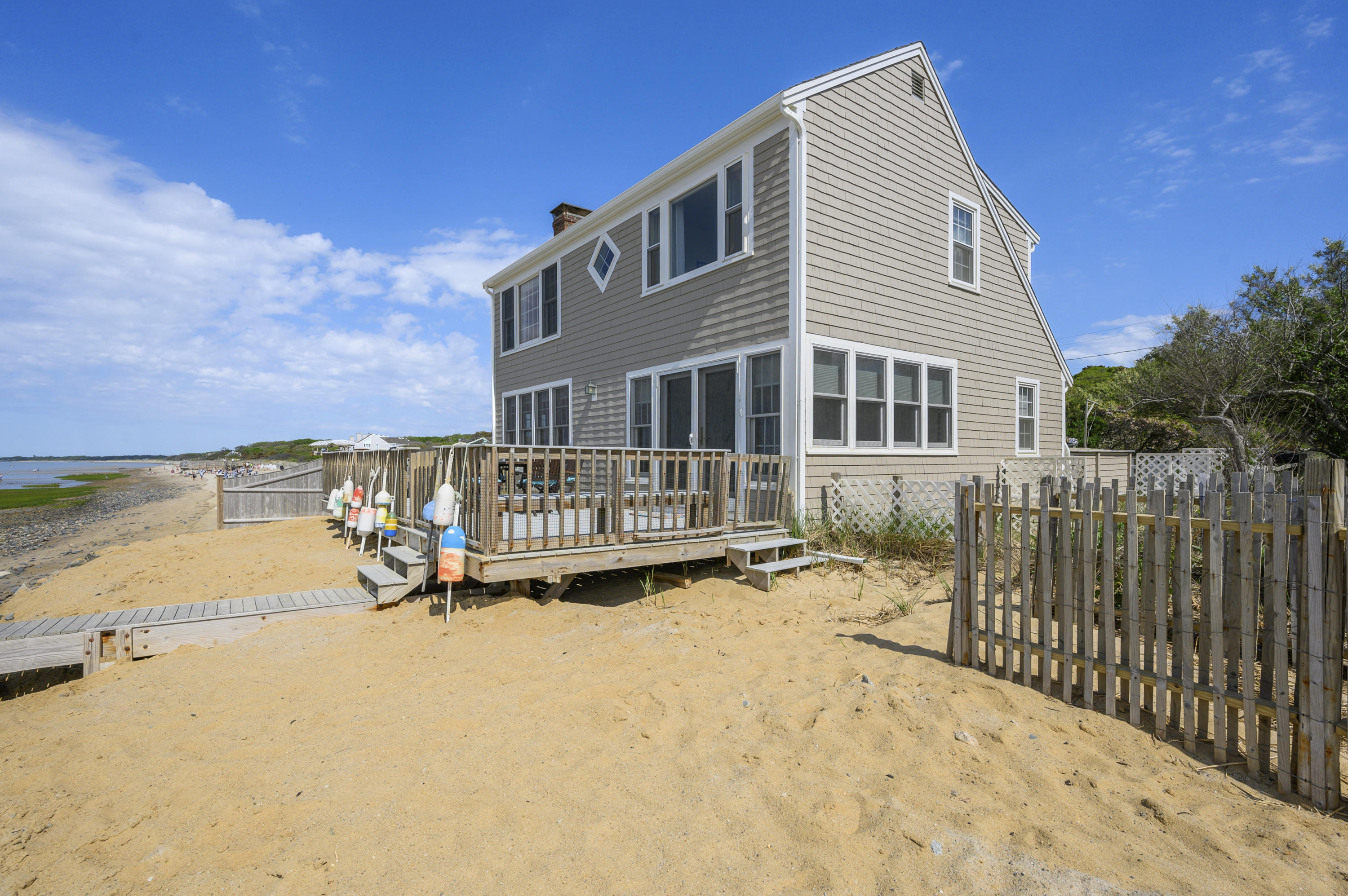 51 Captain Dunbar Road Brewster, MA 02631 - Photo 33 of 36 a view of a house with a yard and sitting area
