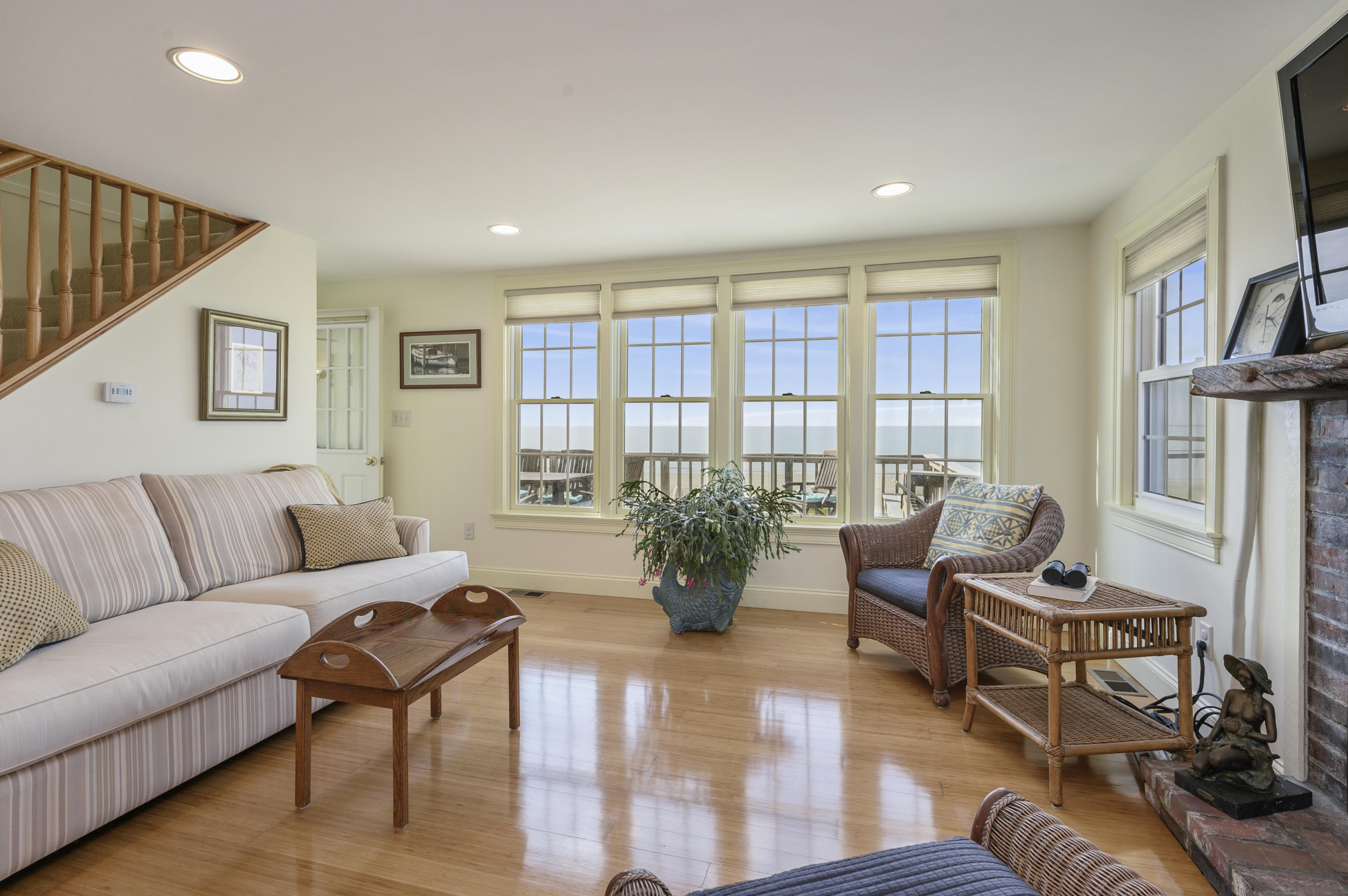 51 Captain Dunbar Road Brewster, MA 02631 - Photo 9 of 36 a living room with furniture and a potted plant