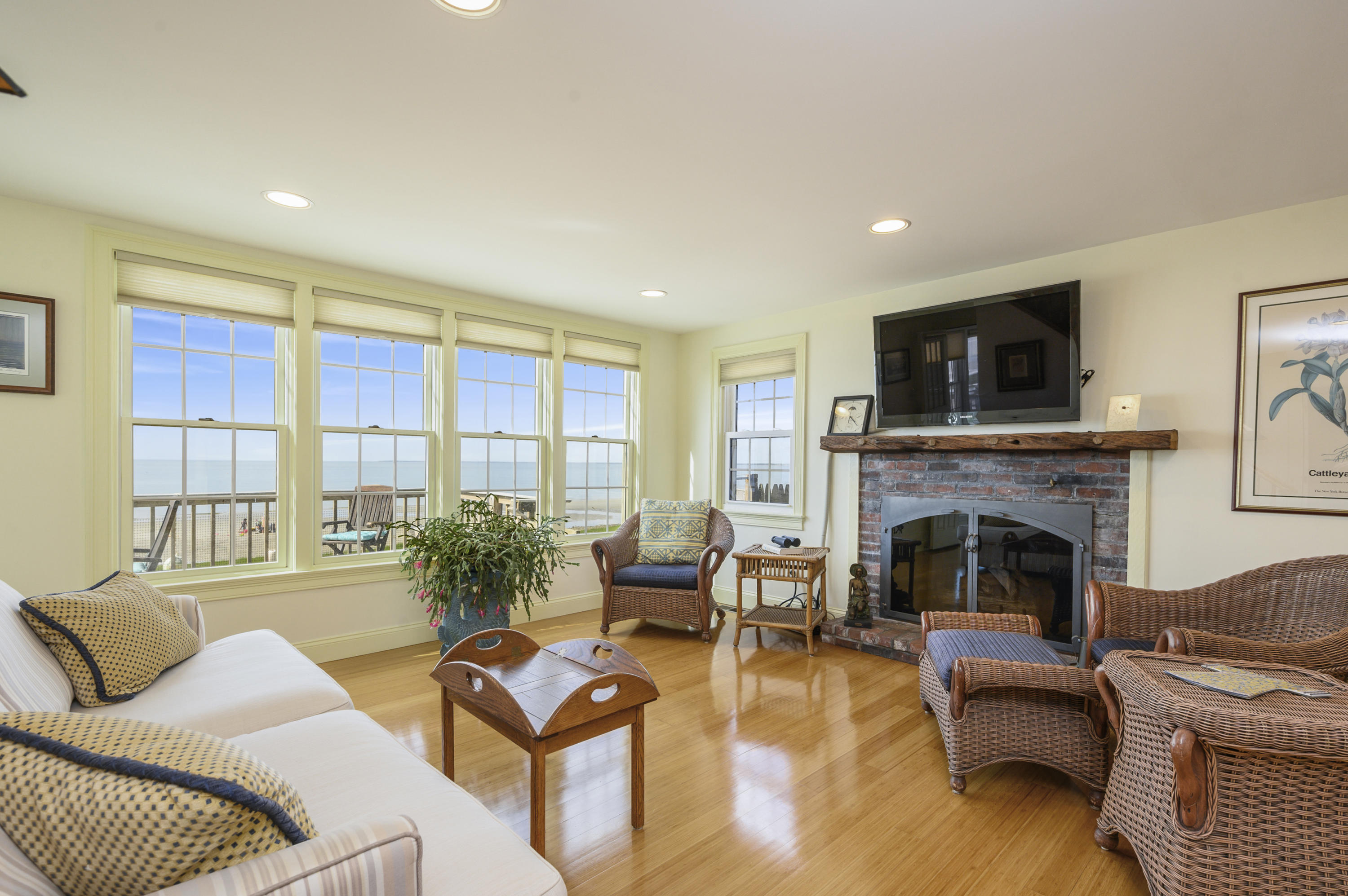 51 Captain Dunbar Road Brewster, MA 02631 - Photo 10 of 36 a living room with furniture fireplace and a flat screen tv