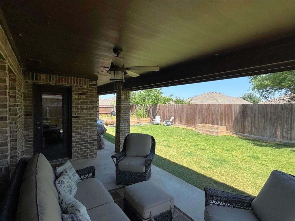 1455 Radecke Road Krum, TX 76249 - Photo 18 of 18 a balcony with furniture and a garden