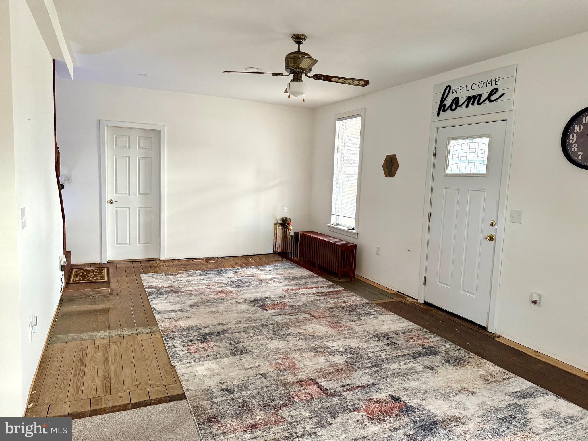 2837 Zion Road Bellefonte, PA 16823 - Photo 3 of 34 a view of a livingroom with wooden floor and a ceiling fan