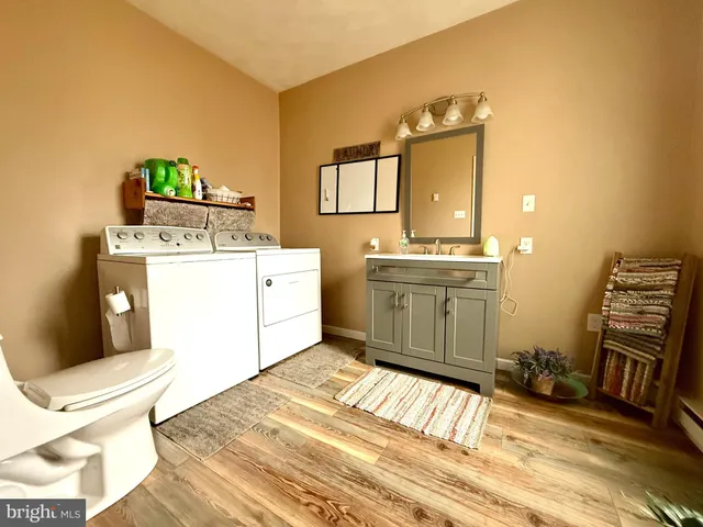 a room with a washing machine and sink