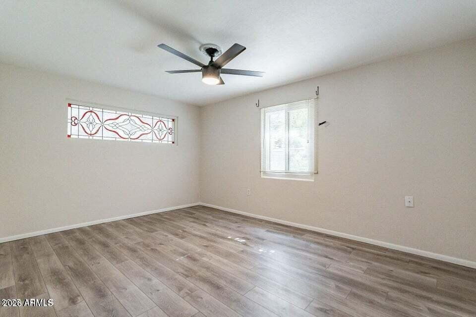 505 West Howe Street Tempe, AZ 85281 - Photo 10 of 20 wooden floor in an empty room with a window