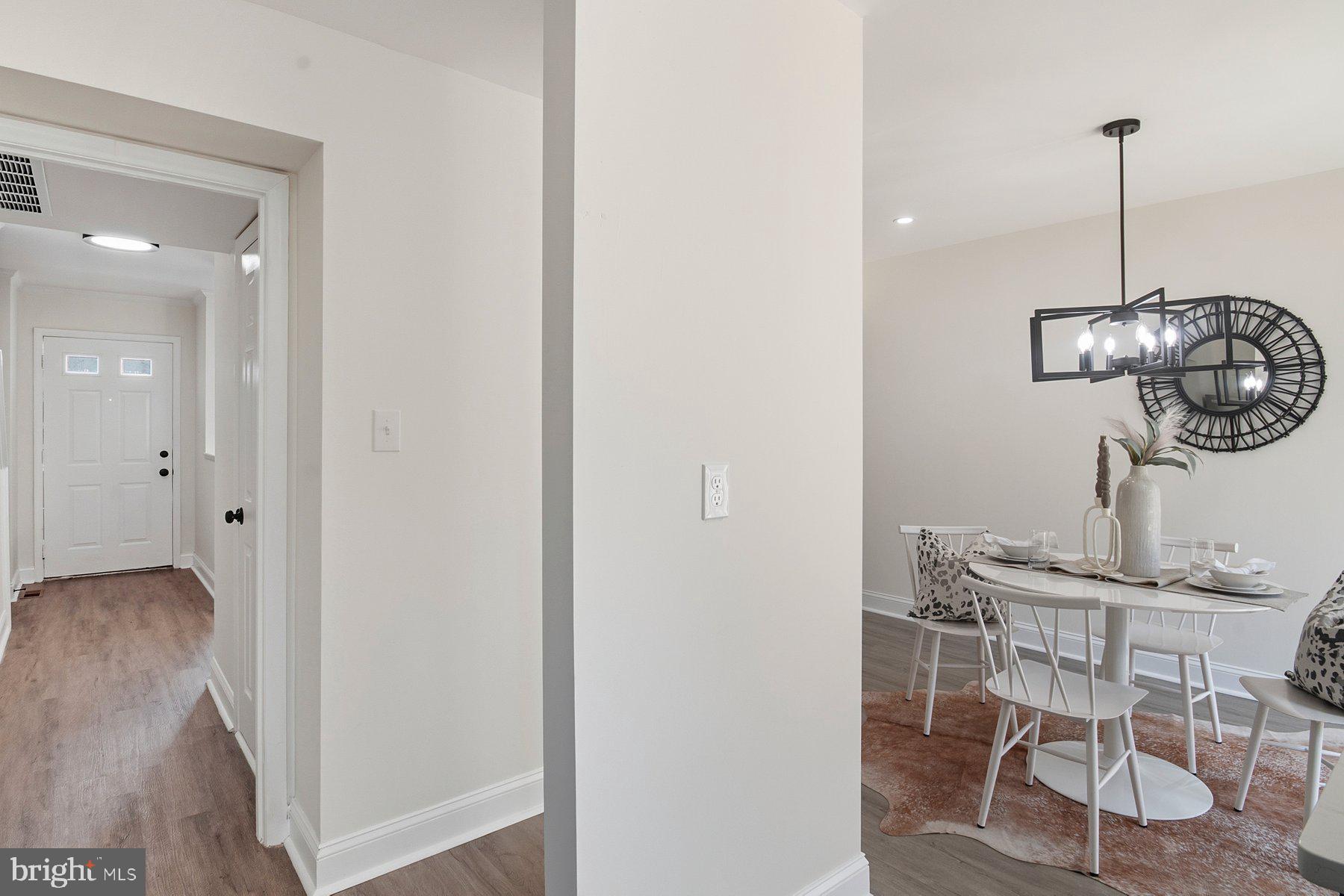 7 Prestwick Square Baltimore, MD 21228 - Photo 16 of 28 a view of dining room and wooden floor