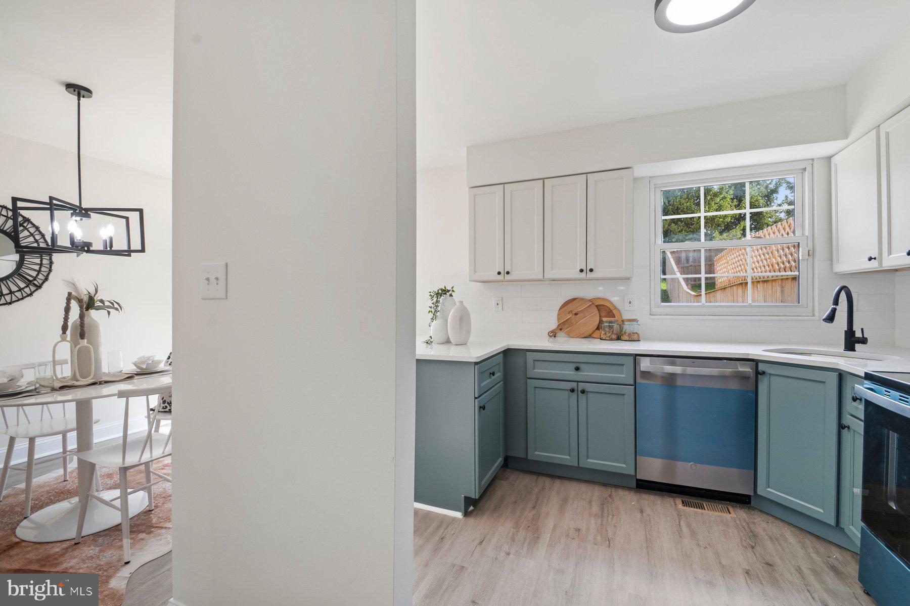 7 Prestwick Square Baltimore, MD 21228 - Photo 17 of 28 a kitchen with cabinets a sink and appliances