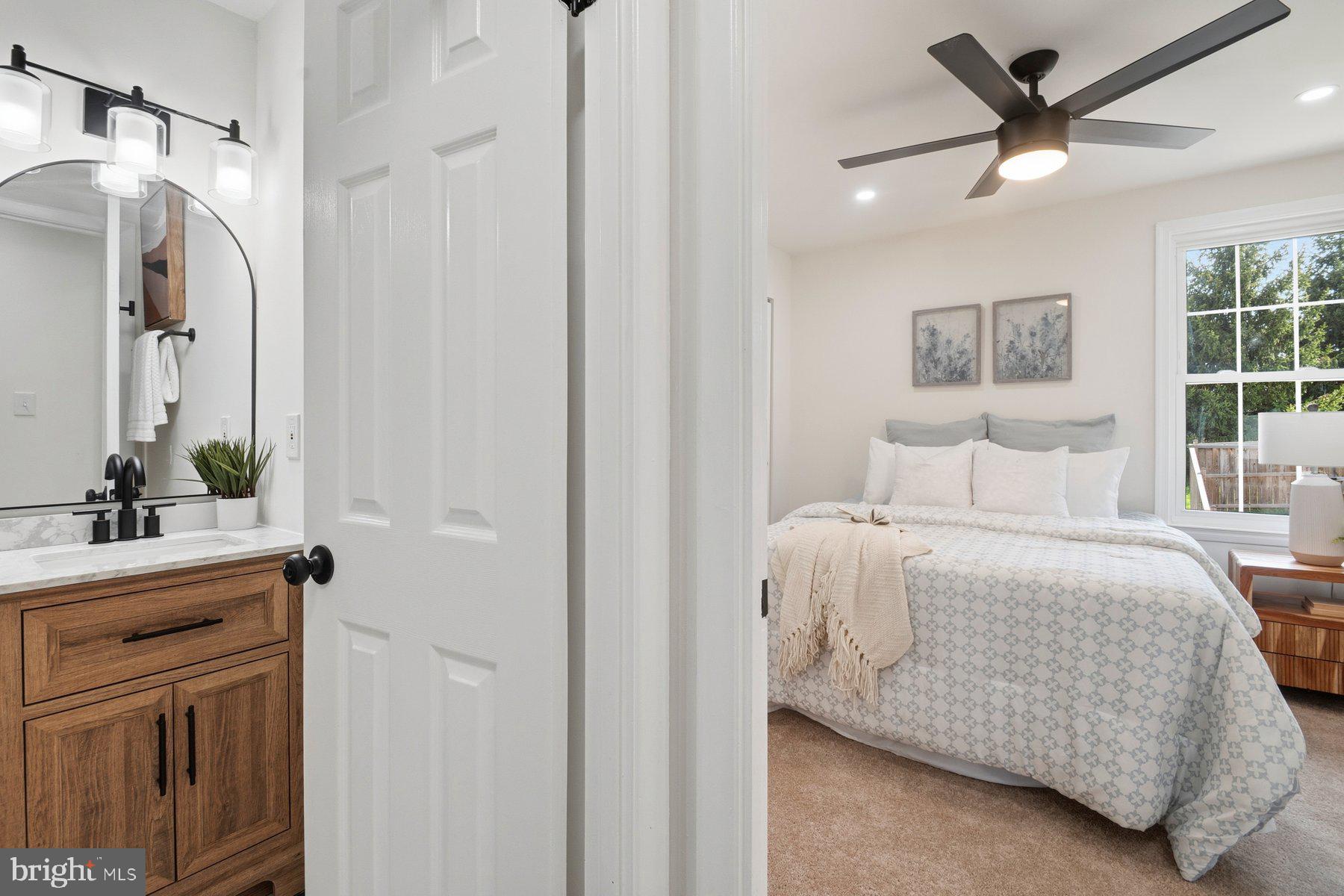 7 Prestwick Square Baltimore, MD 21228 - Photo 18 of 28 a bedroom with a bed and a mirror on a dresser