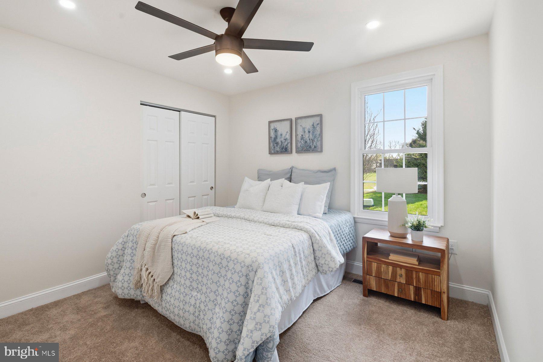 7 Prestwick Square Baltimore, MD 21228 - Photo 19 of 28 a bedroom with a bed and a chandelier