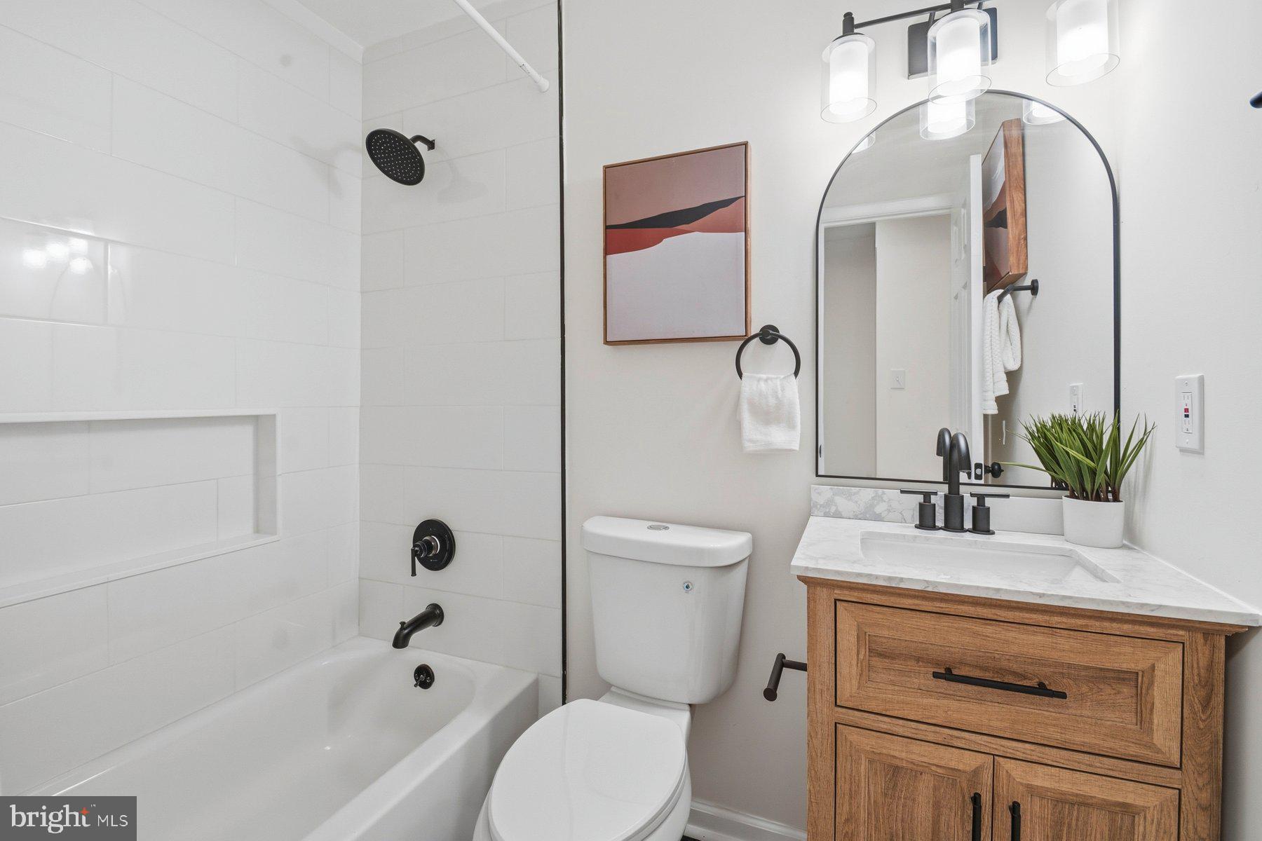 7 Prestwick Square Baltimore, MD 21228 - Photo 20 of 28 a bathroom with a sink a toilet and a mirror