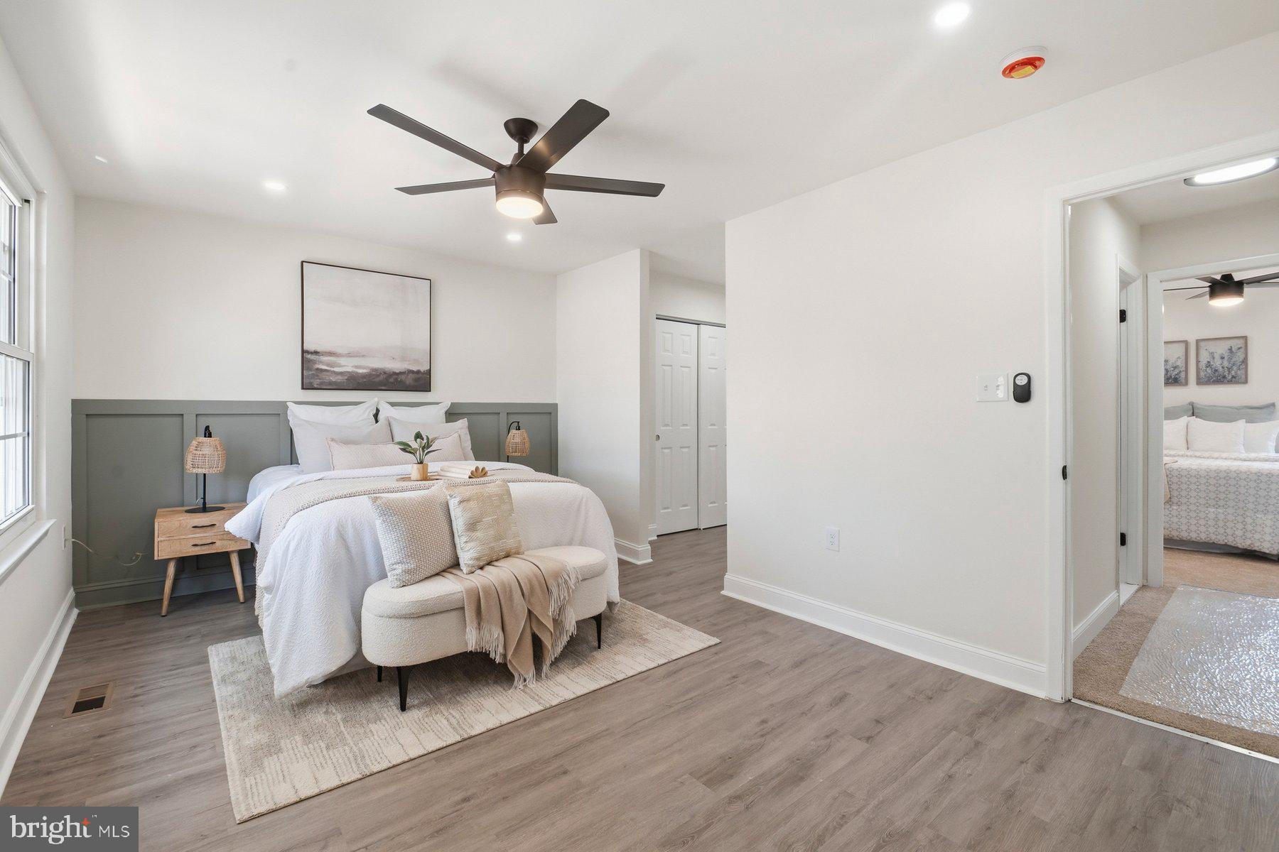 7 Prestwick Square Baltimore, MD 21228 - Photo 22 of 28 a bed room with a bed and a ceiling fan