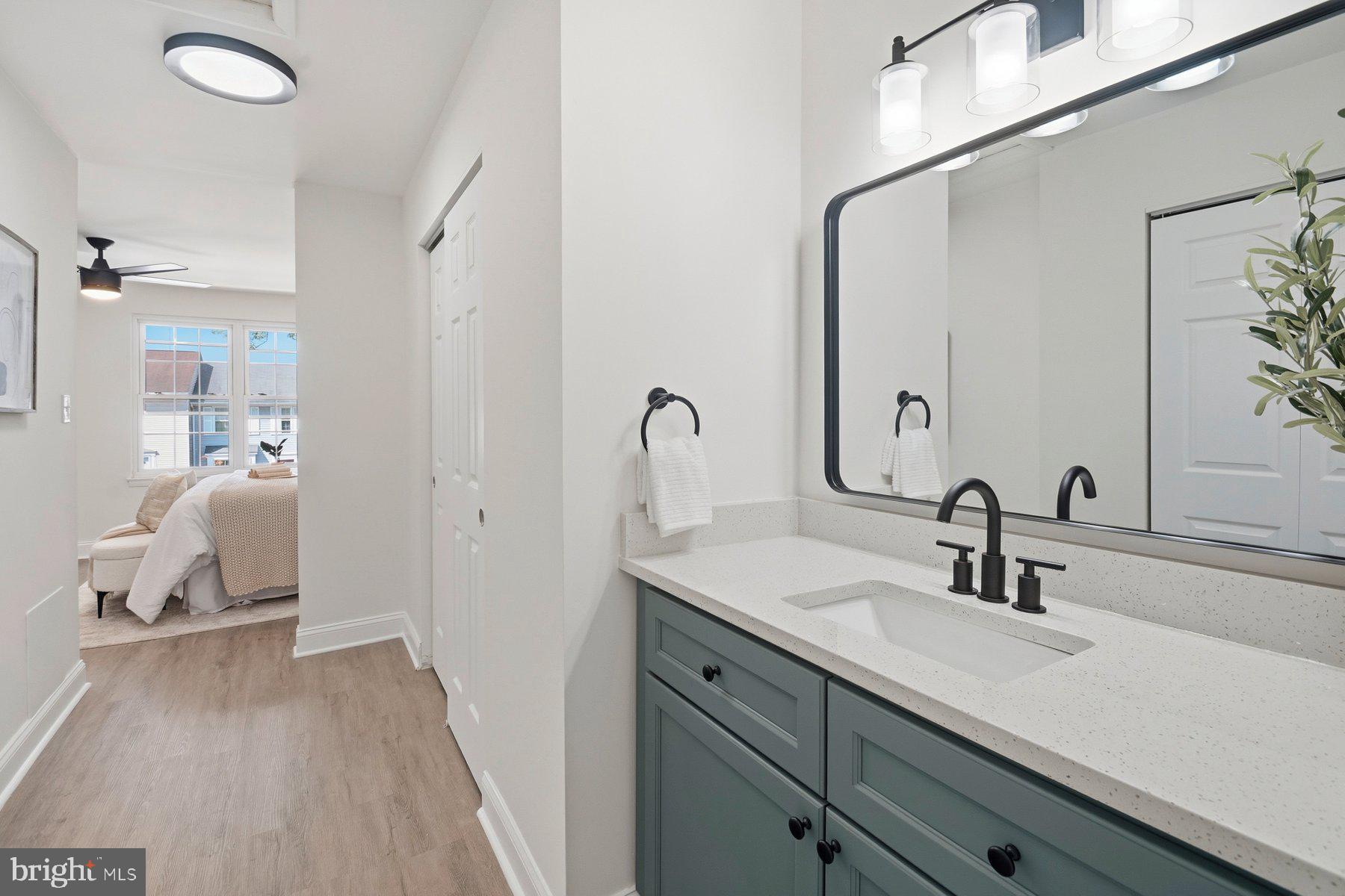 7 Prestwick Square Baltimore, MD 21228 - Photo 25 of 28 a en suite bathroom with a double vanity sink and a mirror