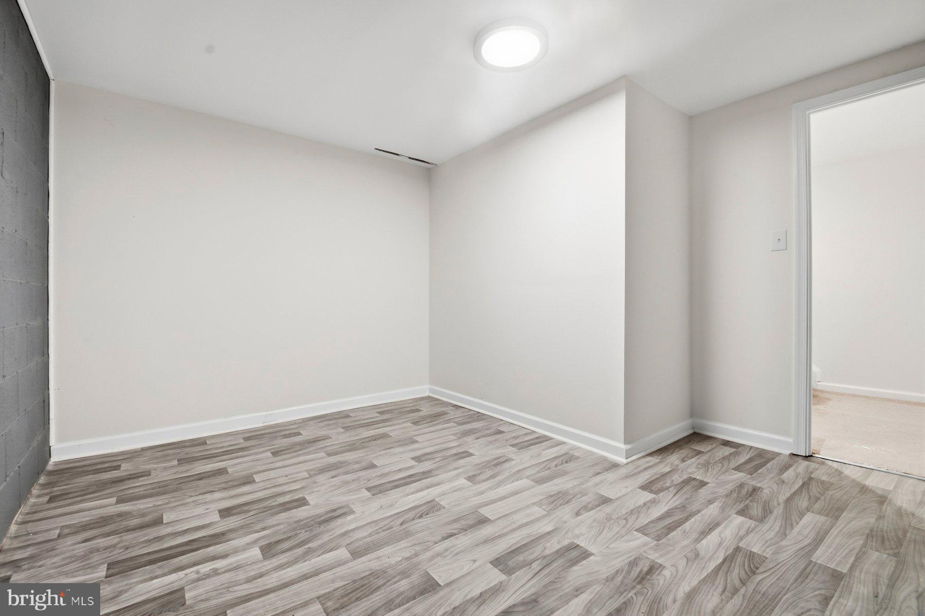 7 Prestwick Square Baltimore, MD 21228 - Photo 27 of 28 a view of a room with wooden floor and white walls