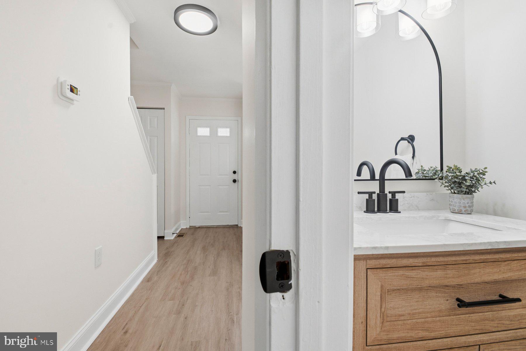 7 Prestwick Square Baltimore, MD 21228 - Photo 8 of 28 a bathroom with a sink and mirror
