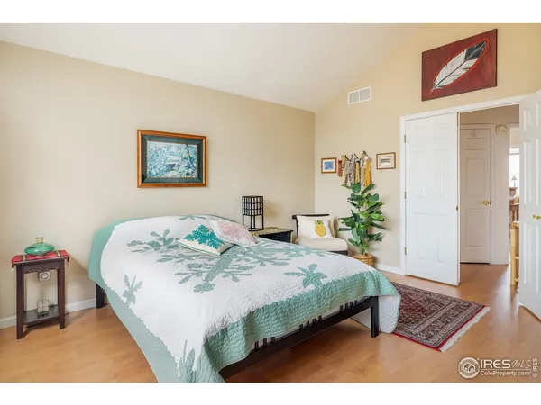 a bedroom with a bed and a table in it