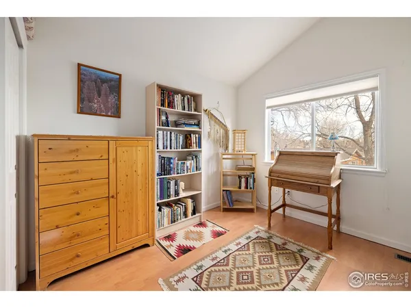 a room with furniture closet and window