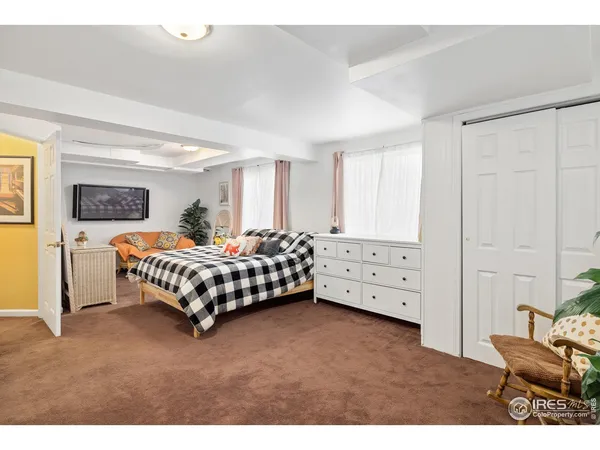 a bedroom with a bed and a view of bedroom