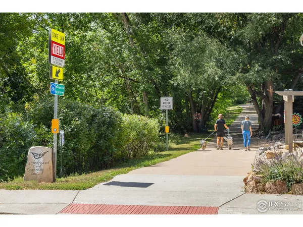 a view of a park with swings and slides