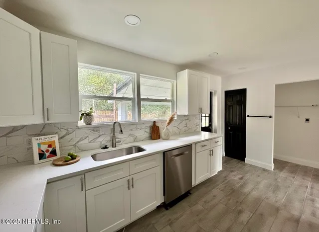 a kitchen with a sink stove and refrigerator